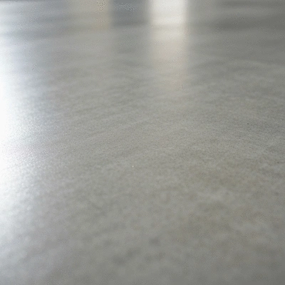 Detail of a perfectly smooth concrete surface, reflecting light