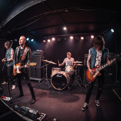 Engineers and construction workers reviewing blueprints on a tablet on a modern construction site